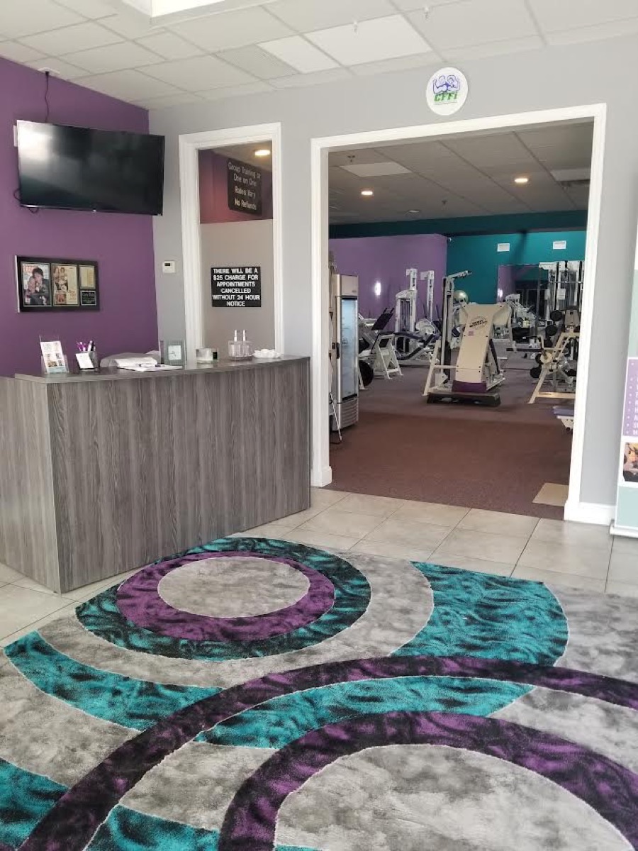 The welcoming front desk and training floor at Carla Fields Fitness